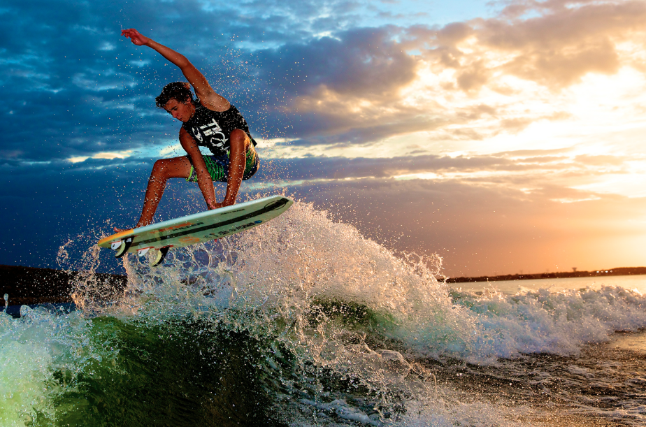 Parker Payne boosting an air during a sunset on Lake Lewisville, photo by Mark Payne